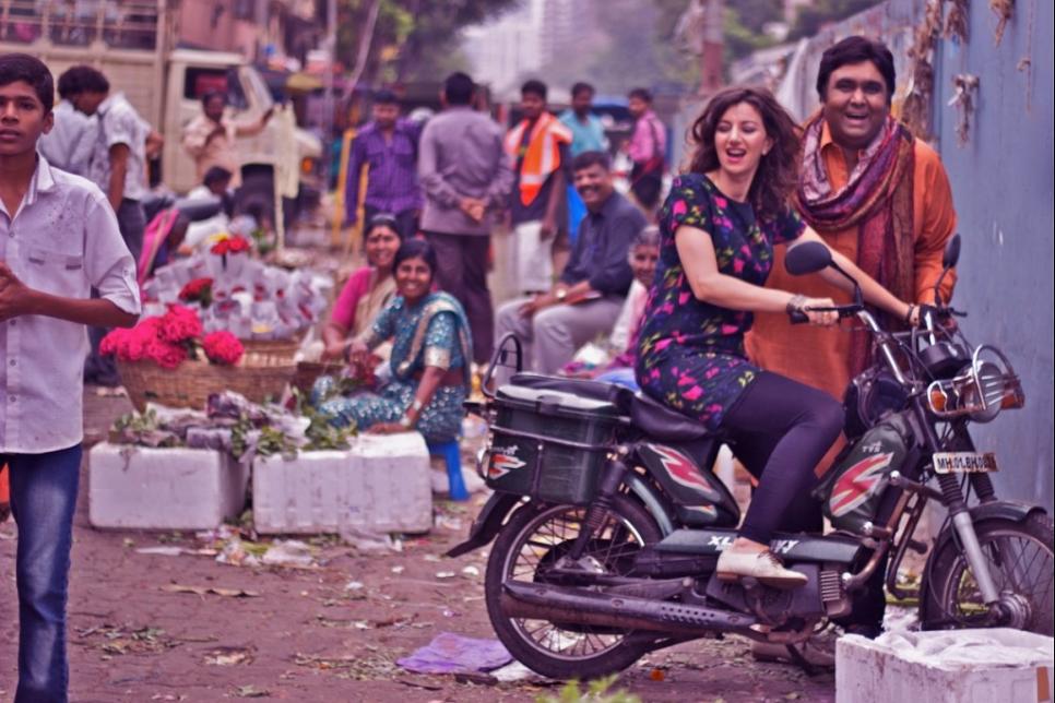 Gwyneth Glyn and Tauseef Akhtar with a motorbike in India