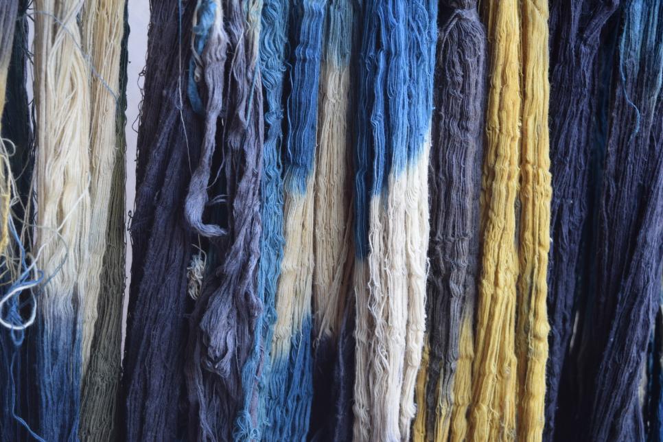 Fabrics hanging to dry after using indigo dye