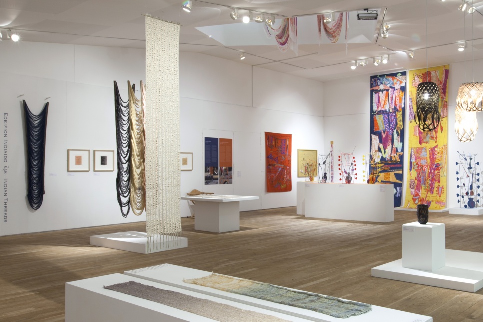Exhibition of colourful textiles within a white space