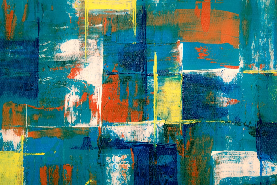 An abstract image of paint marks in blue, turquoise, yellow and orange