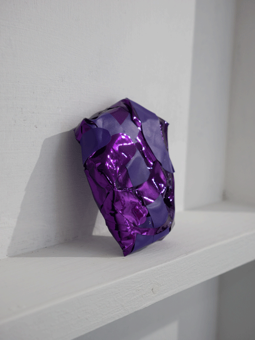 A purple stone artwork display by artist Rebecca F Hardy