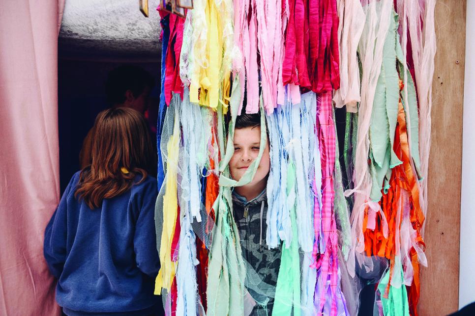 Children playing with colourful rags
