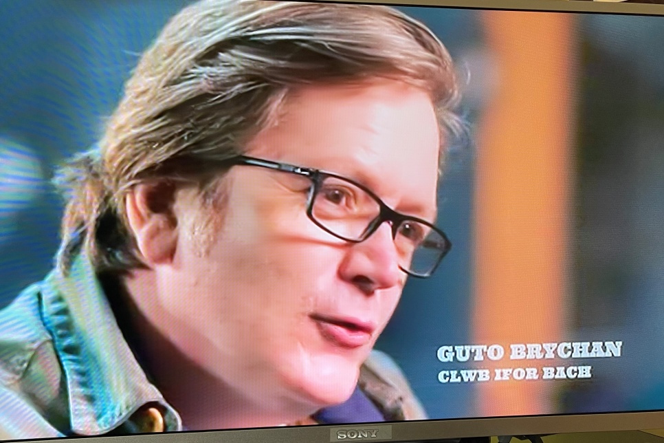 Guto Brychan on the screen of a television 