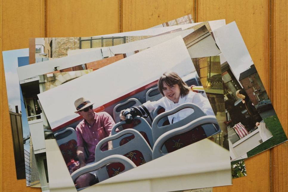 A pile of printed photos on a table