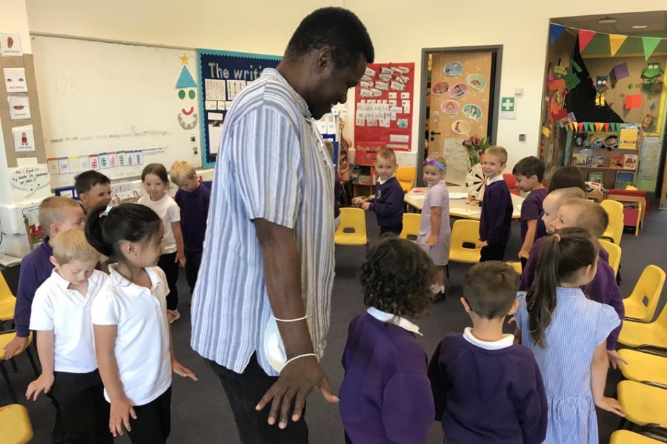 Creative Agent Bevin,  with school pupils in class